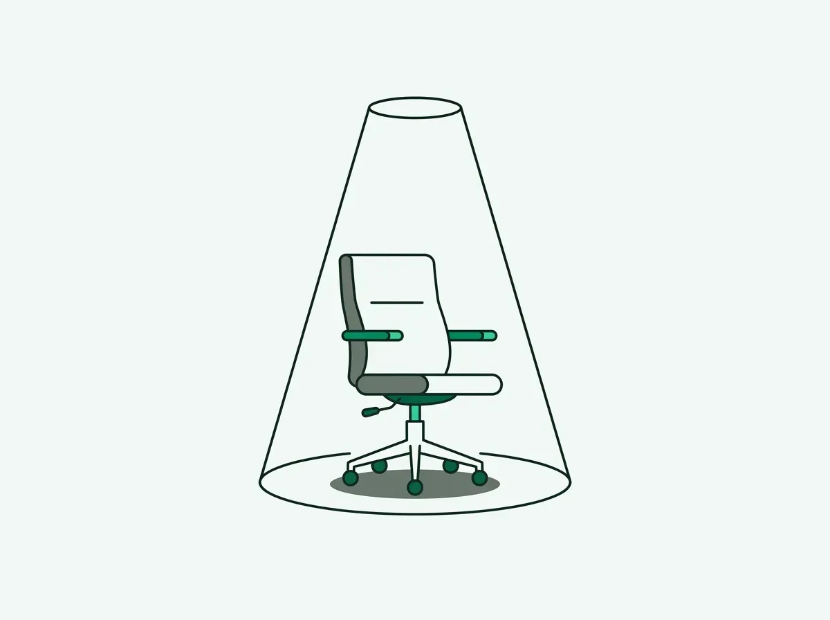 An illustration of an empty chair in a spotlight, symbolizing a new role a company is hiring for.